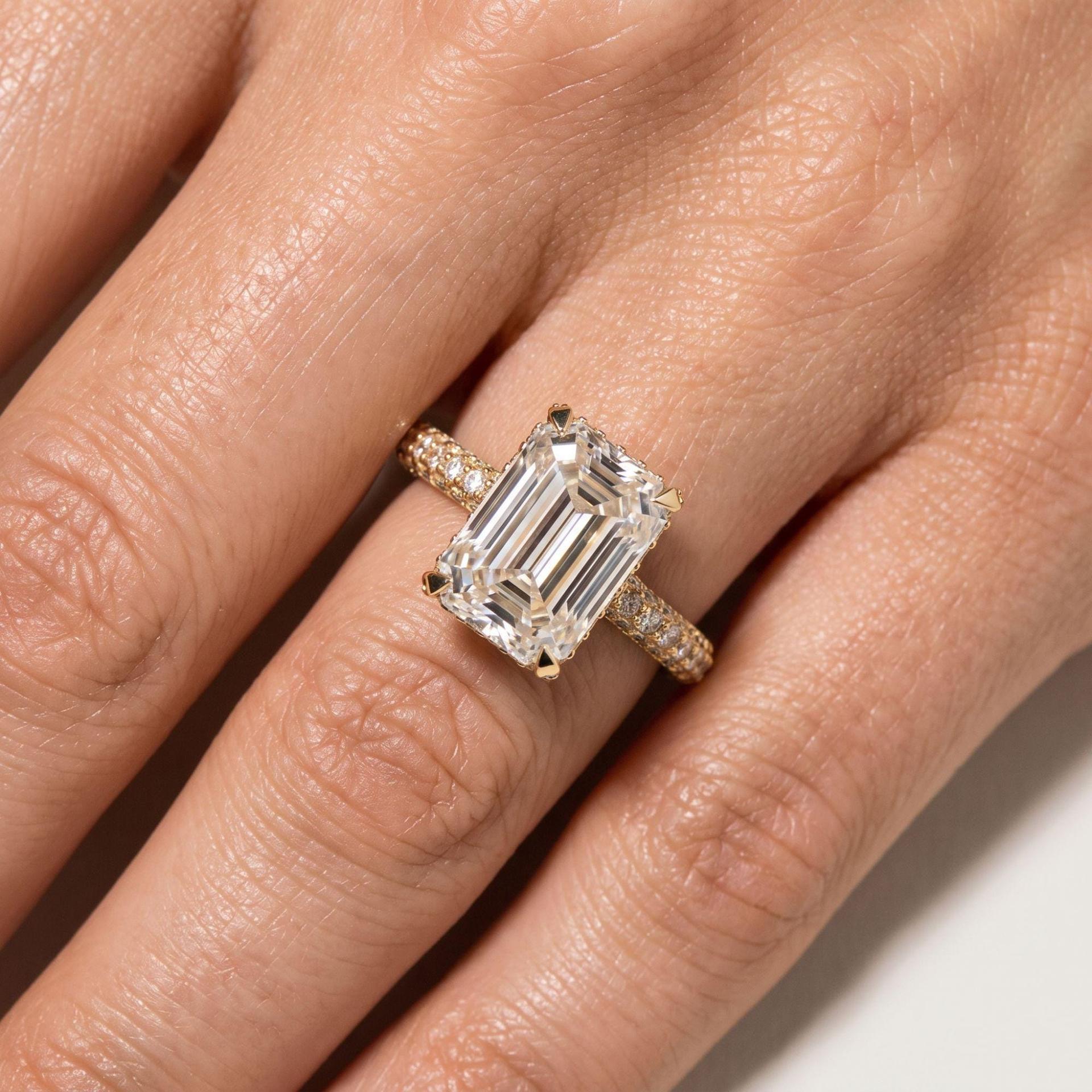 Emerald Cut Diamond Ring with Hidden Halo Pavé Shank on model