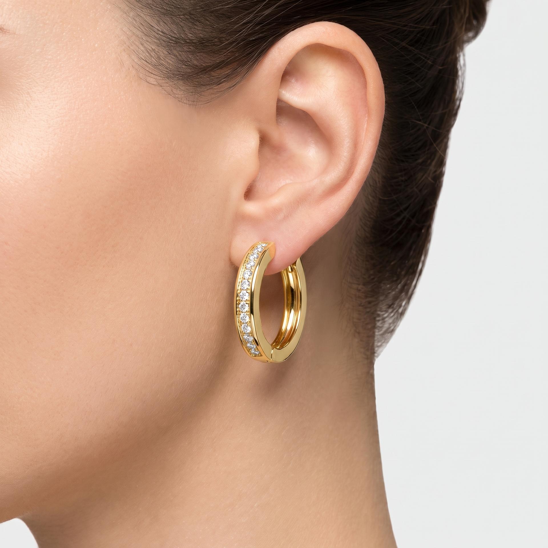 Round Diamond Channel Set Huggie Hoop Earrings on model