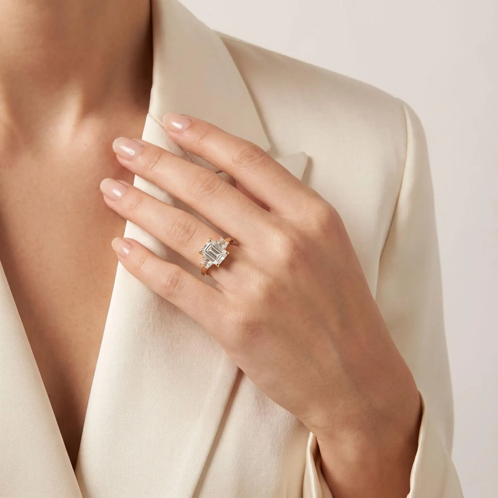 Emerald & Trapezoid Diamond Three Stone Ring on model