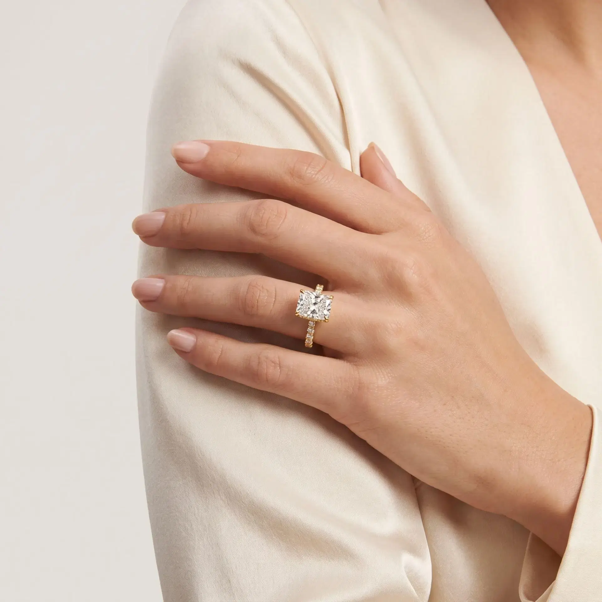 Radiant Cut Diamond Hidden Halo Ring with Pavé Shank on model