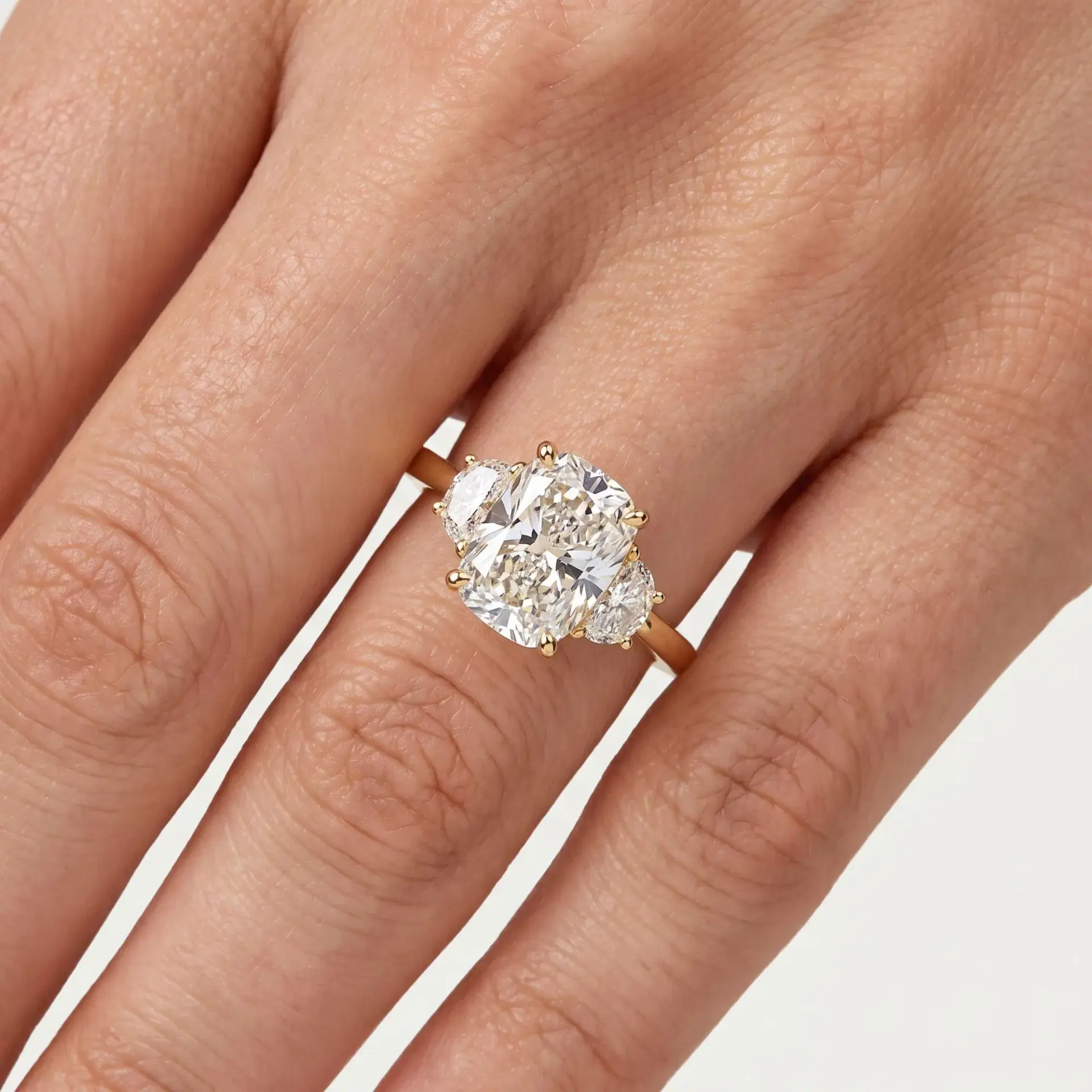 Elongated Cushion & Half Moon Diamond Three Stone Ring on model