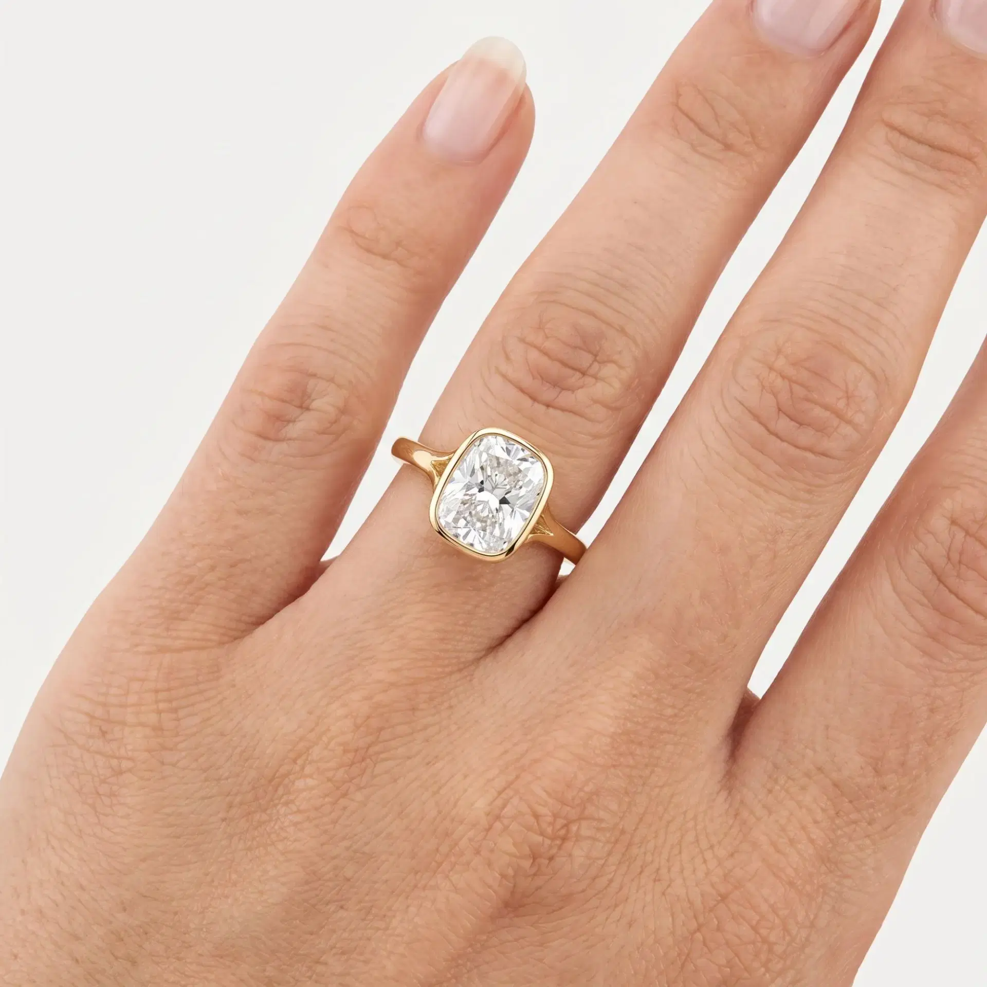 Elongated Cushion Diamond Bezel Solitaire Ring on model