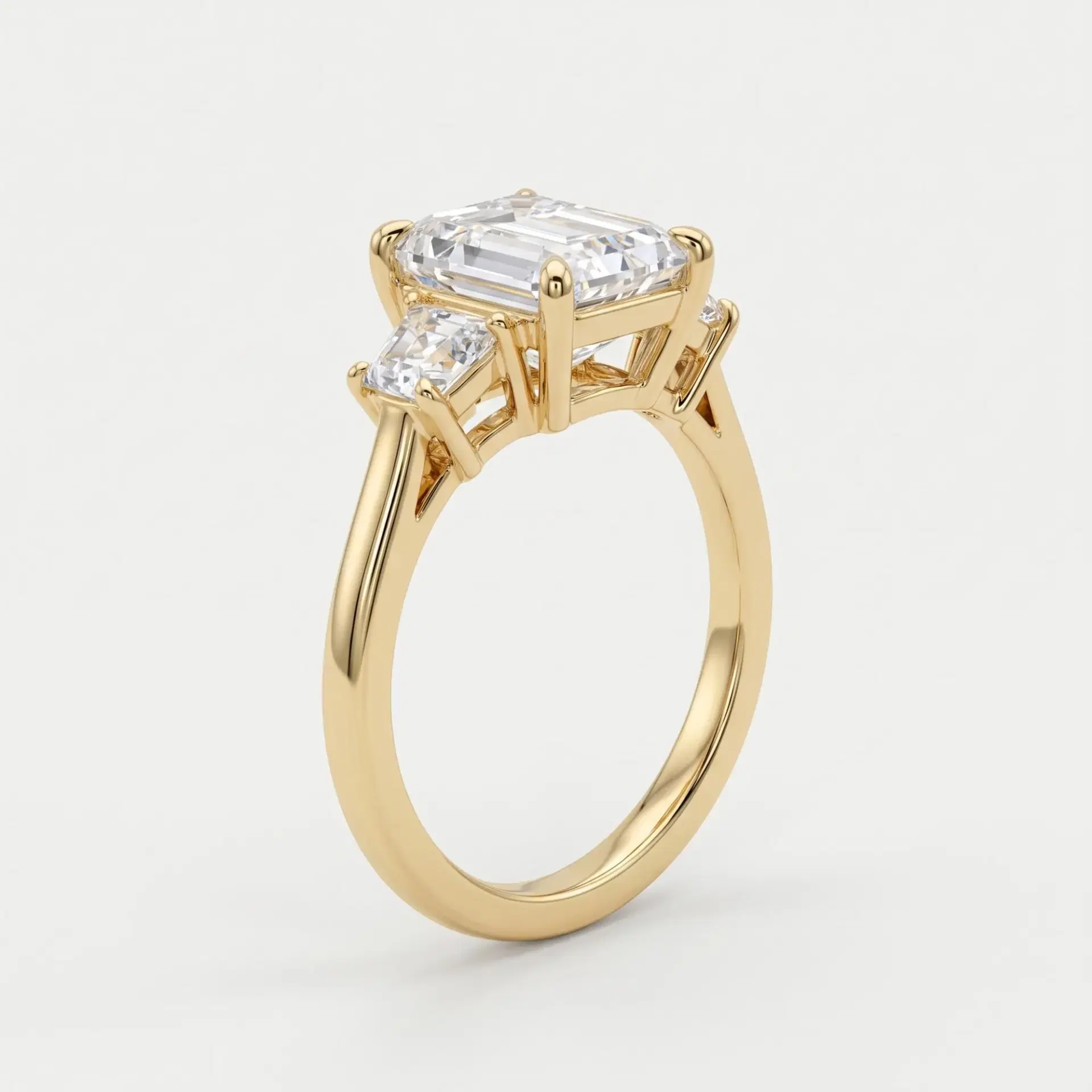 Emerald & Trapezoid Diamond Three Stone Ring on model