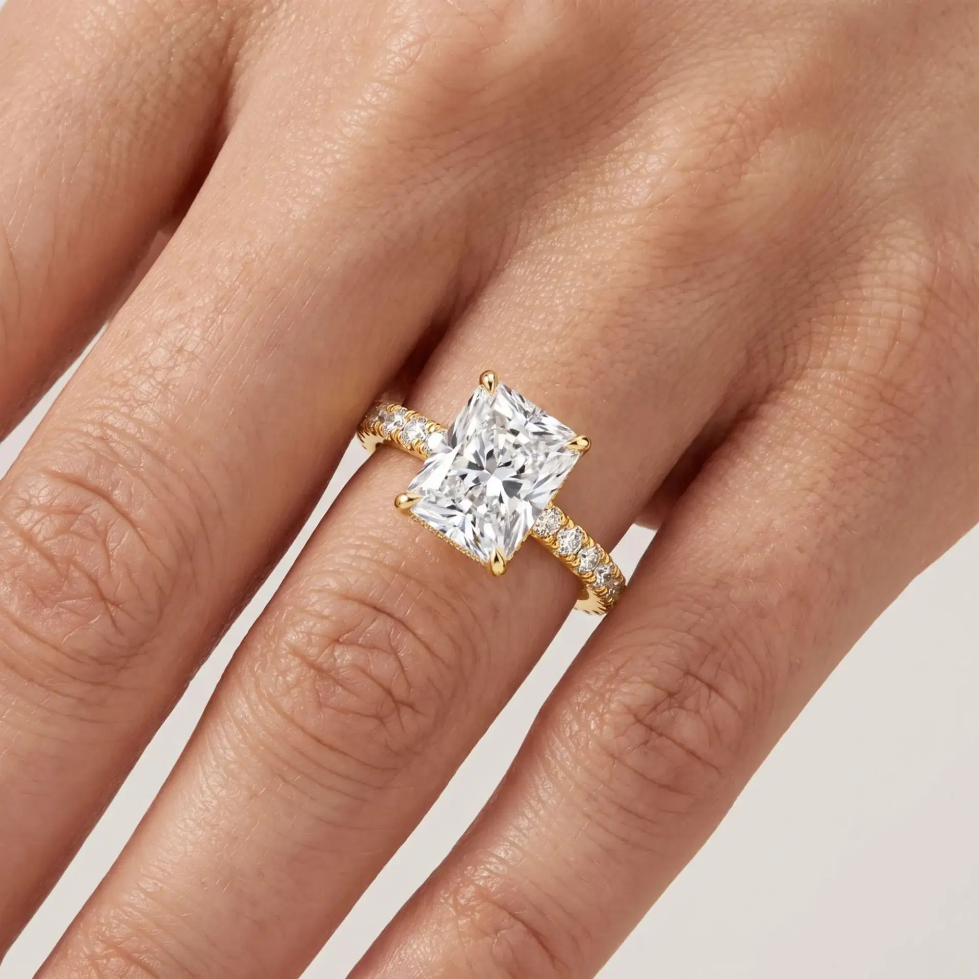 Radiant Cut Diamond Hidden Halo Ring with Pavé Shank on model