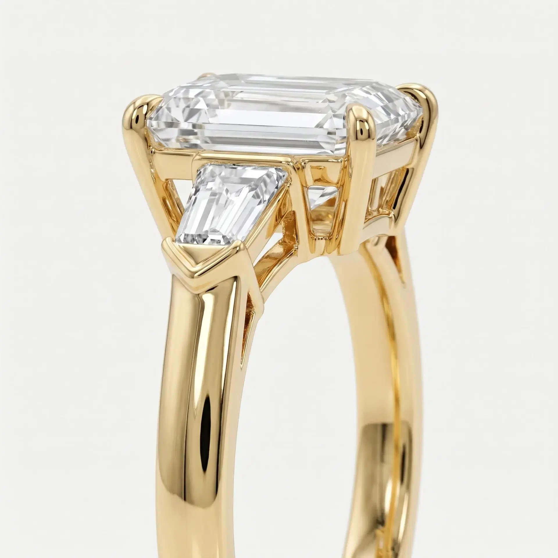 Tapered Baguette and Emerald Cut Diamond Ring on model