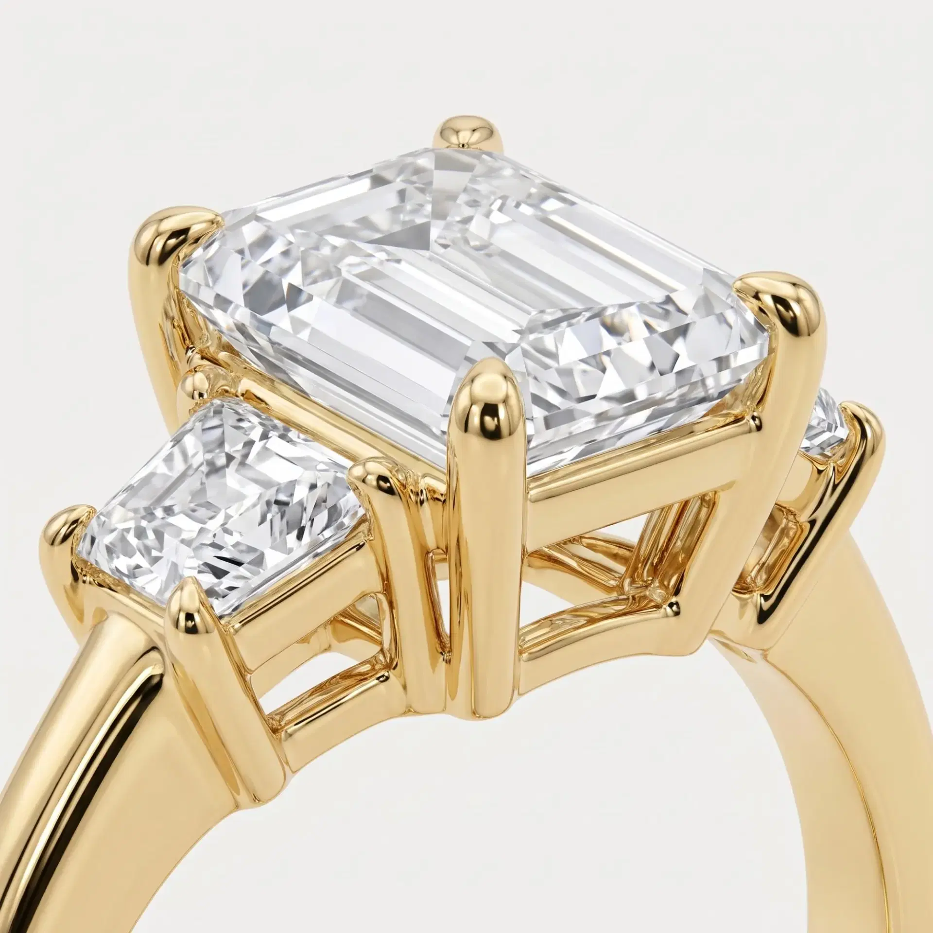 Emerald & Trapezoid Diamond Three Stone Ring on model