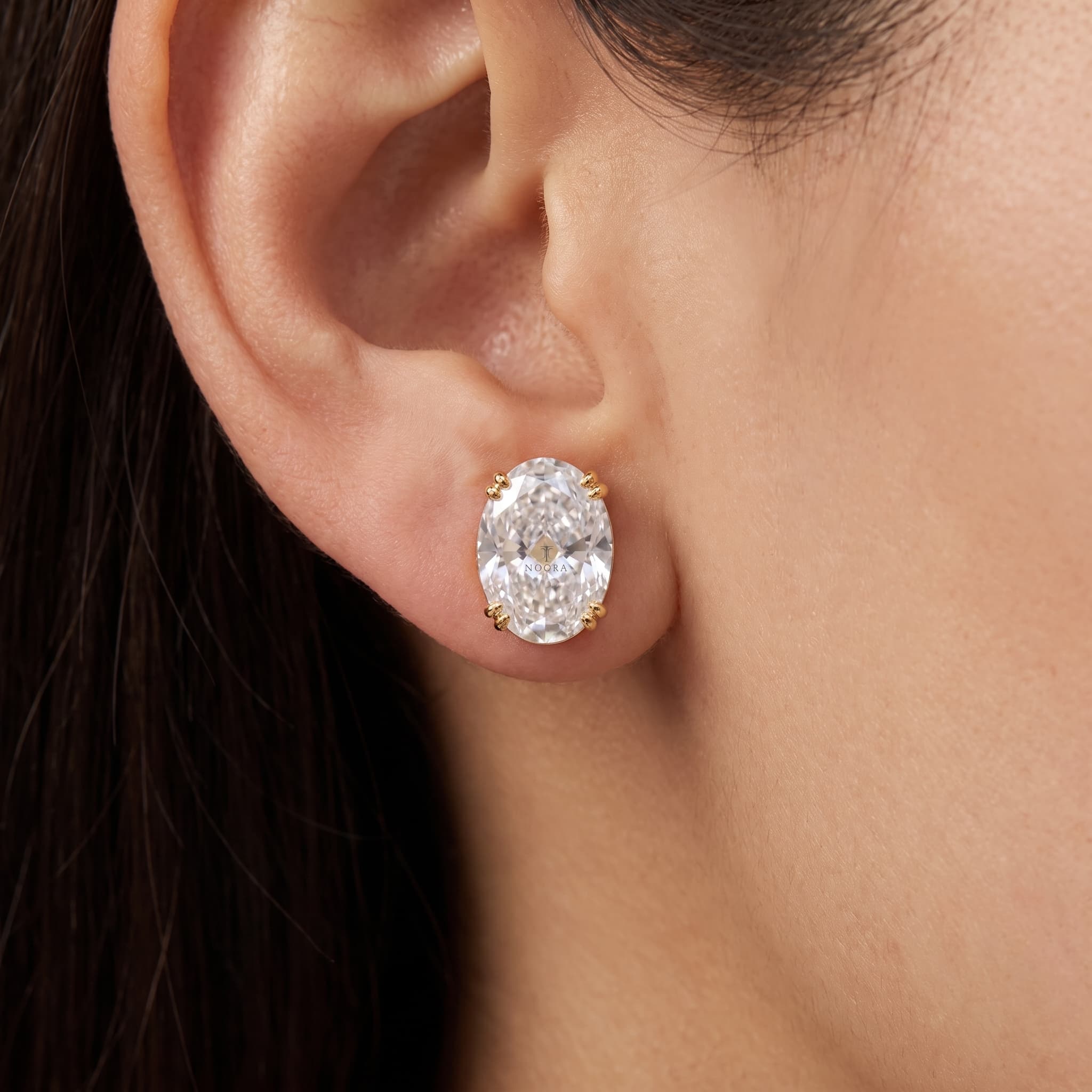 Pure Oval — Oval Cut Diamond Stud Earrings on model