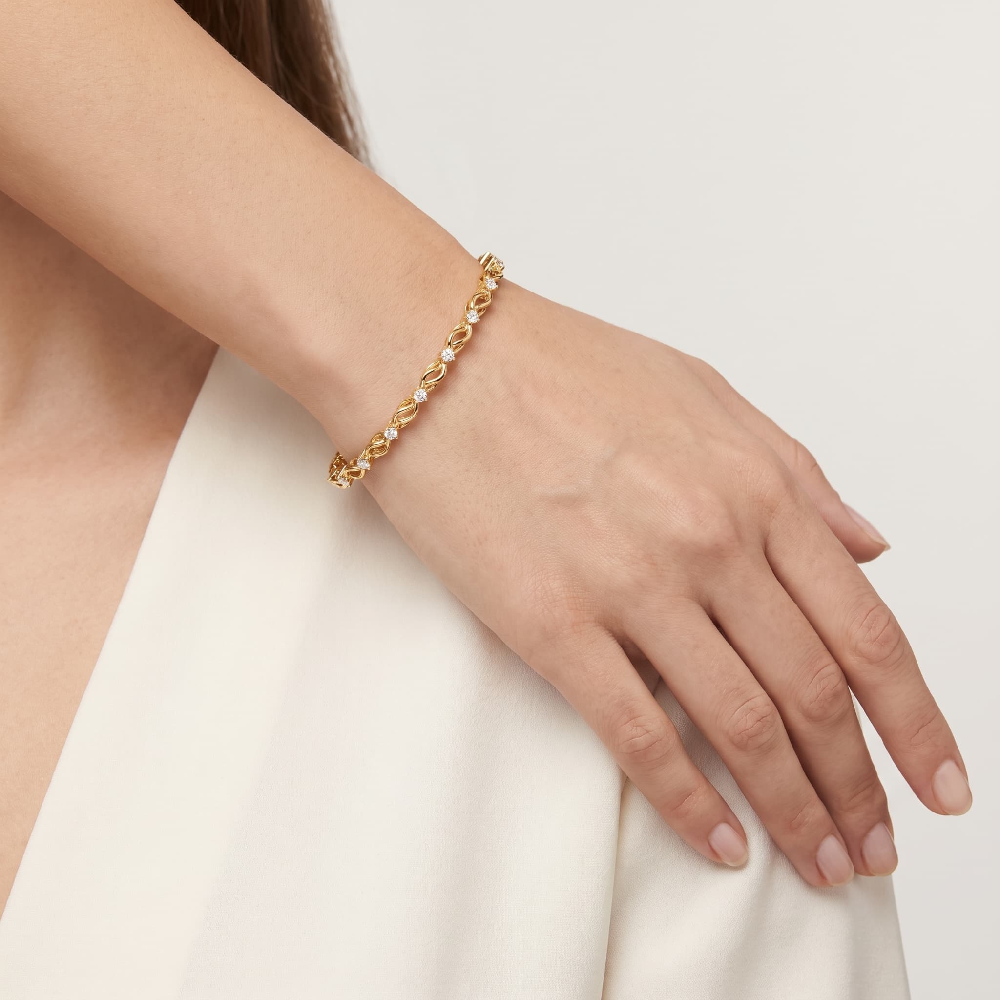 Infinite Kiss — Round Diamond X & Infinity Link Tennis Bracelet thumbnail 3