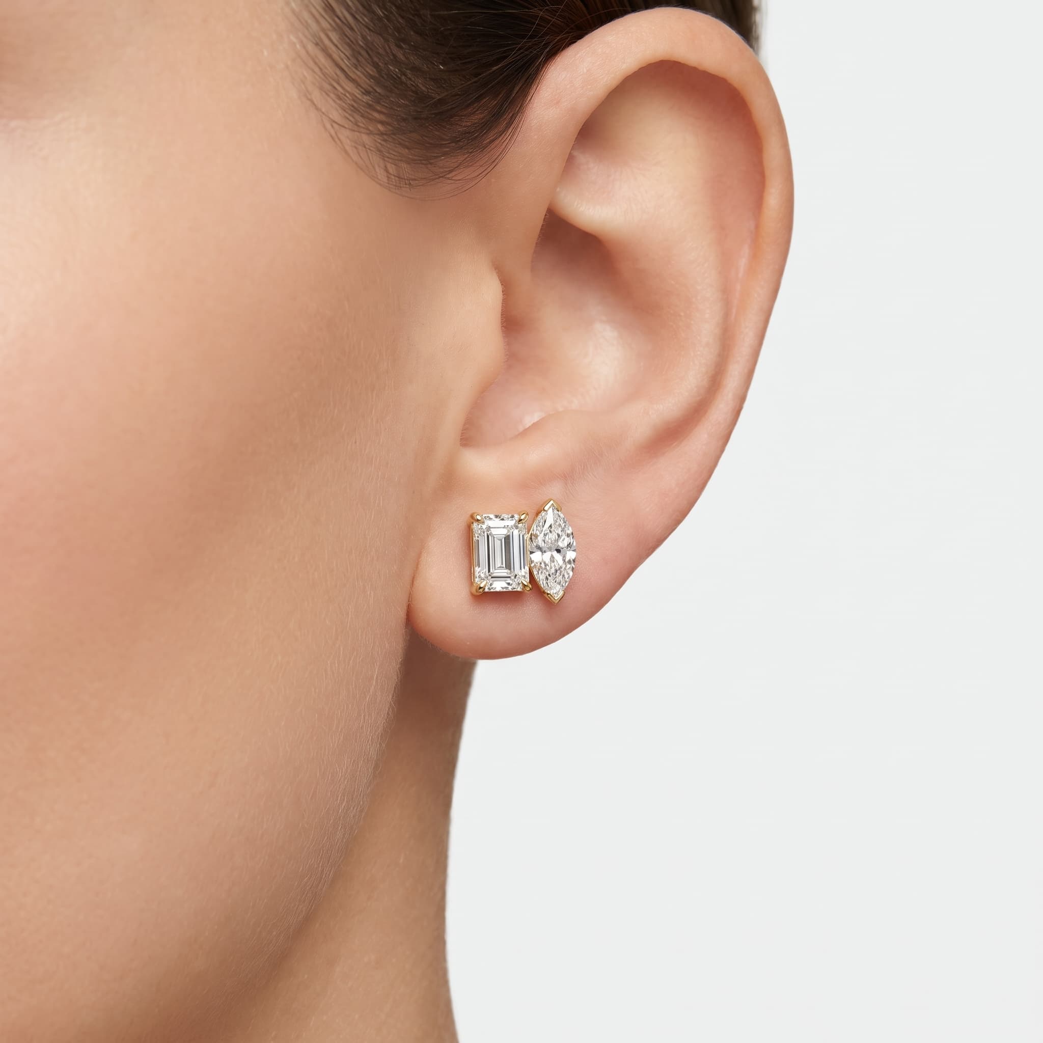 Dual Grace — Emerald & Marquise Diamond Two-Stone Stud Earrings on model