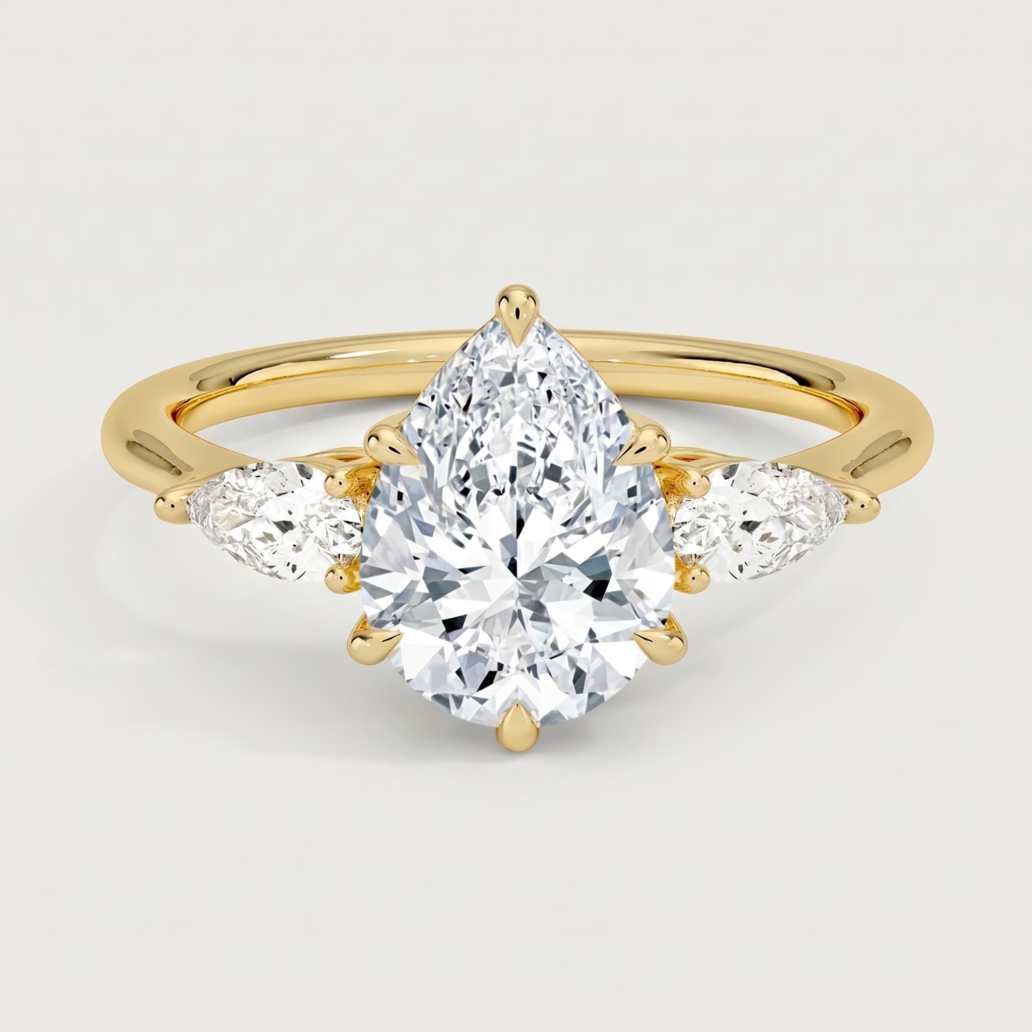 Yesterday, Today, and Forever — Pear Three Stone Ring