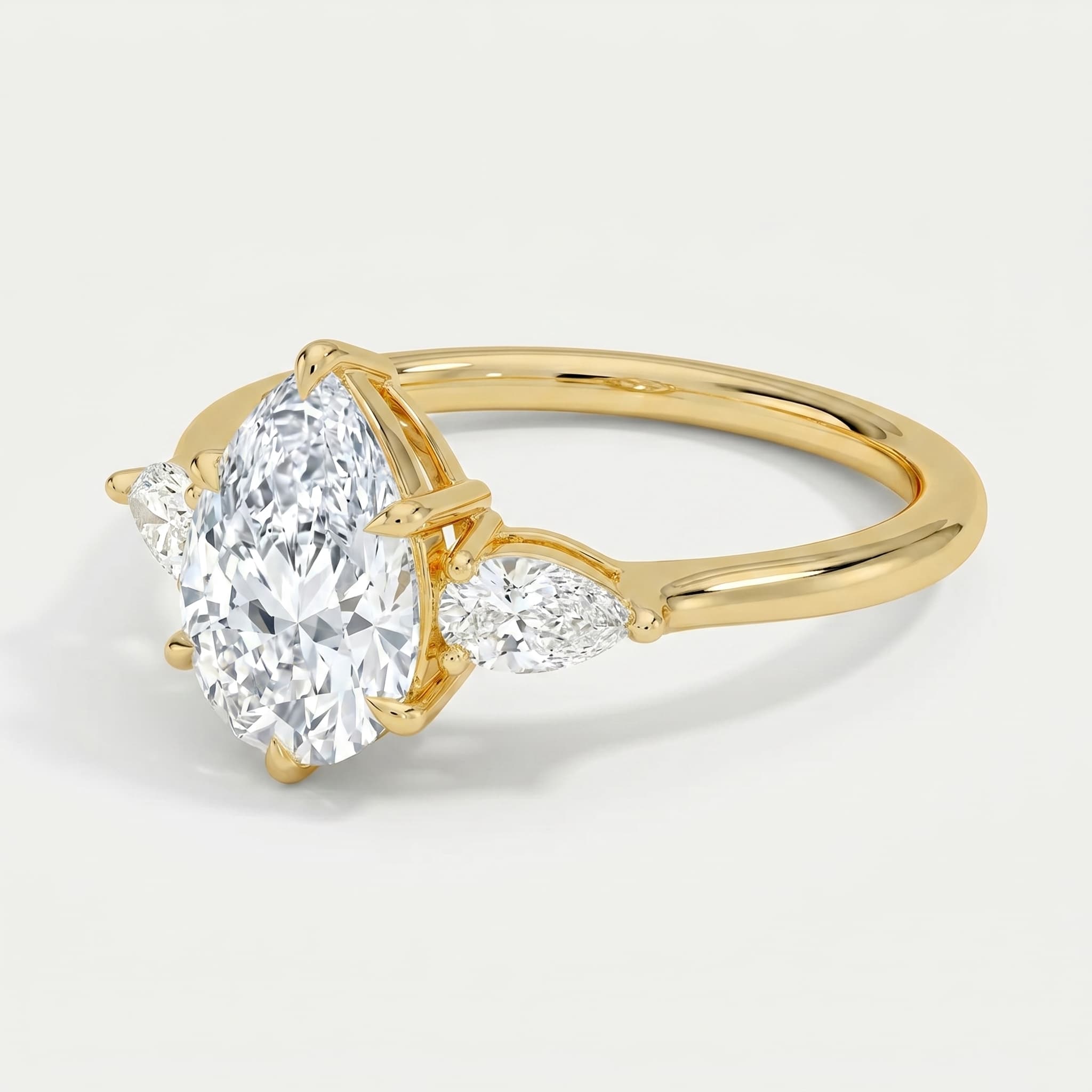 Yesterday, Today, and Forever — Pear Three Stone Ring on model