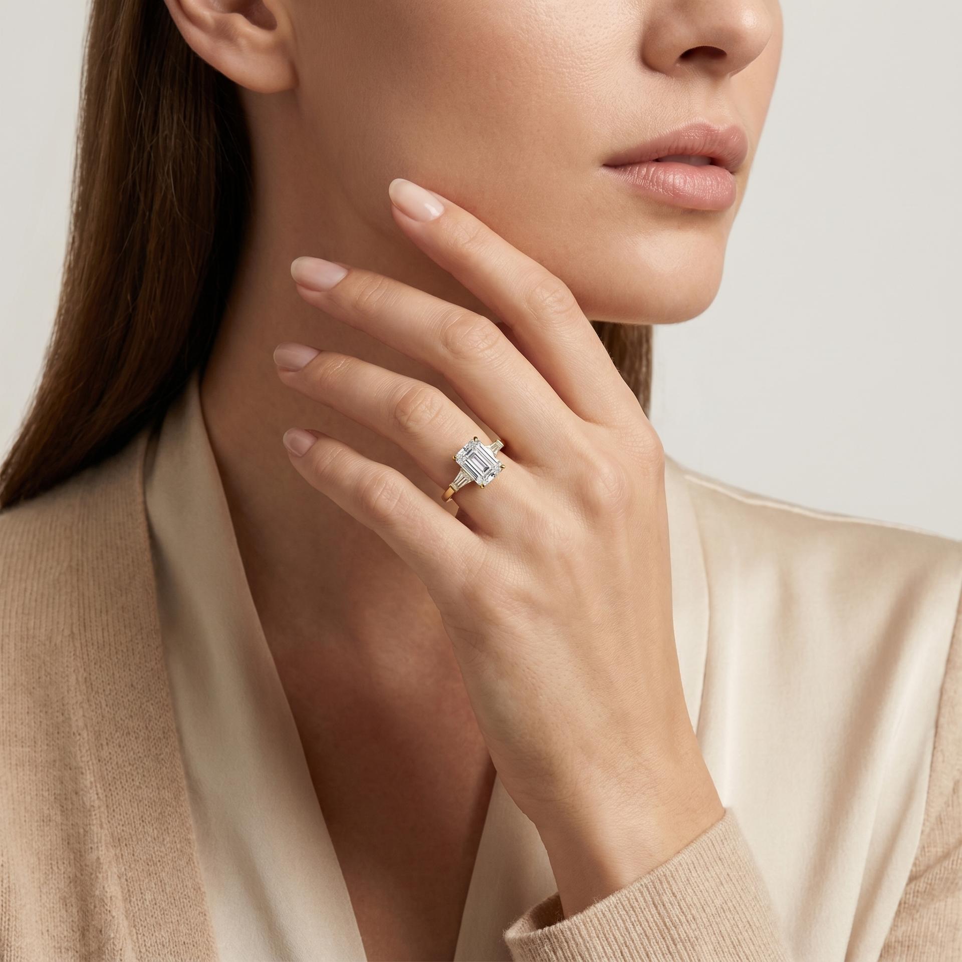 Emerald Three Stone Ring on model