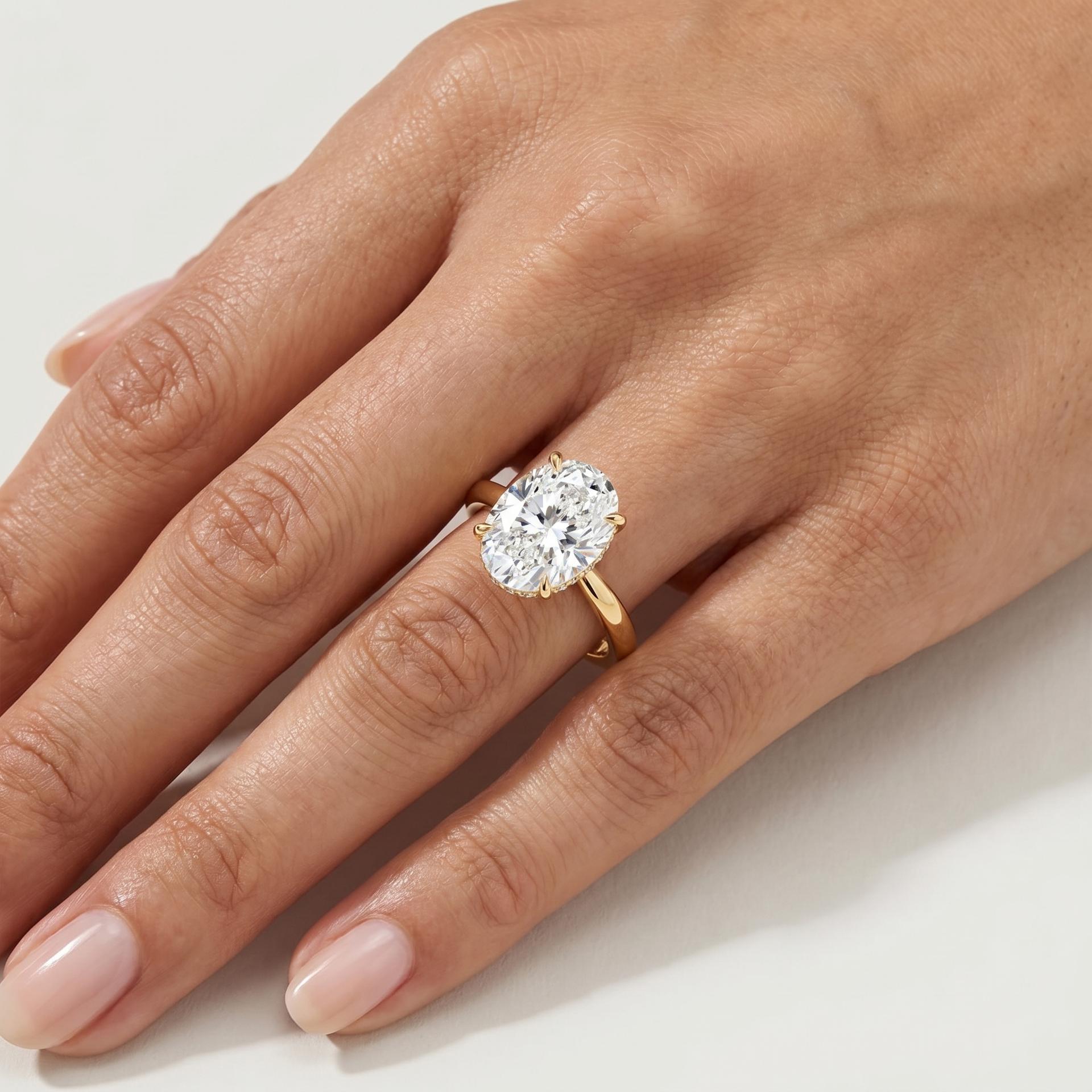 Oval Hidden Halo Solitaire Ring on model