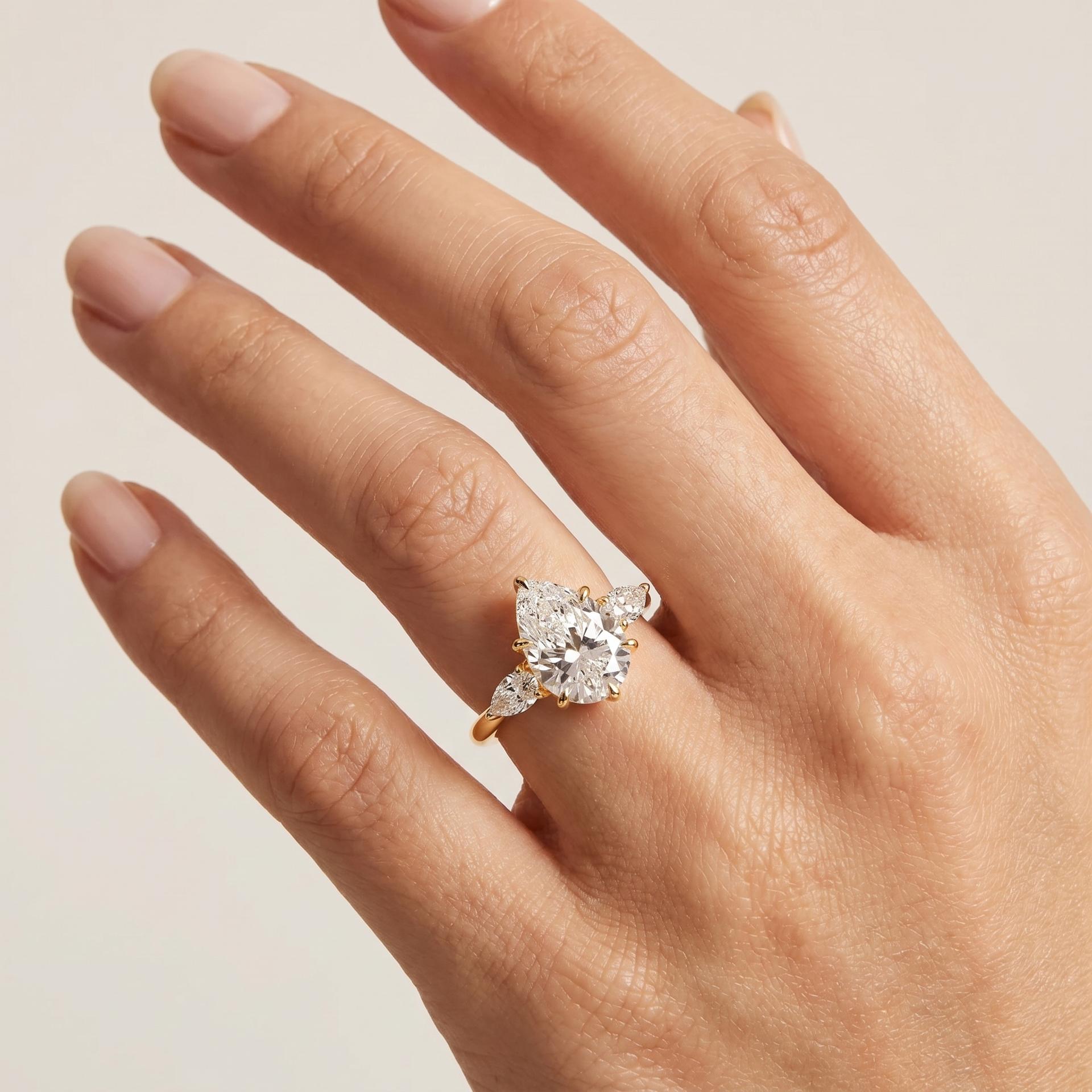 Pear Three Stone Ring on model