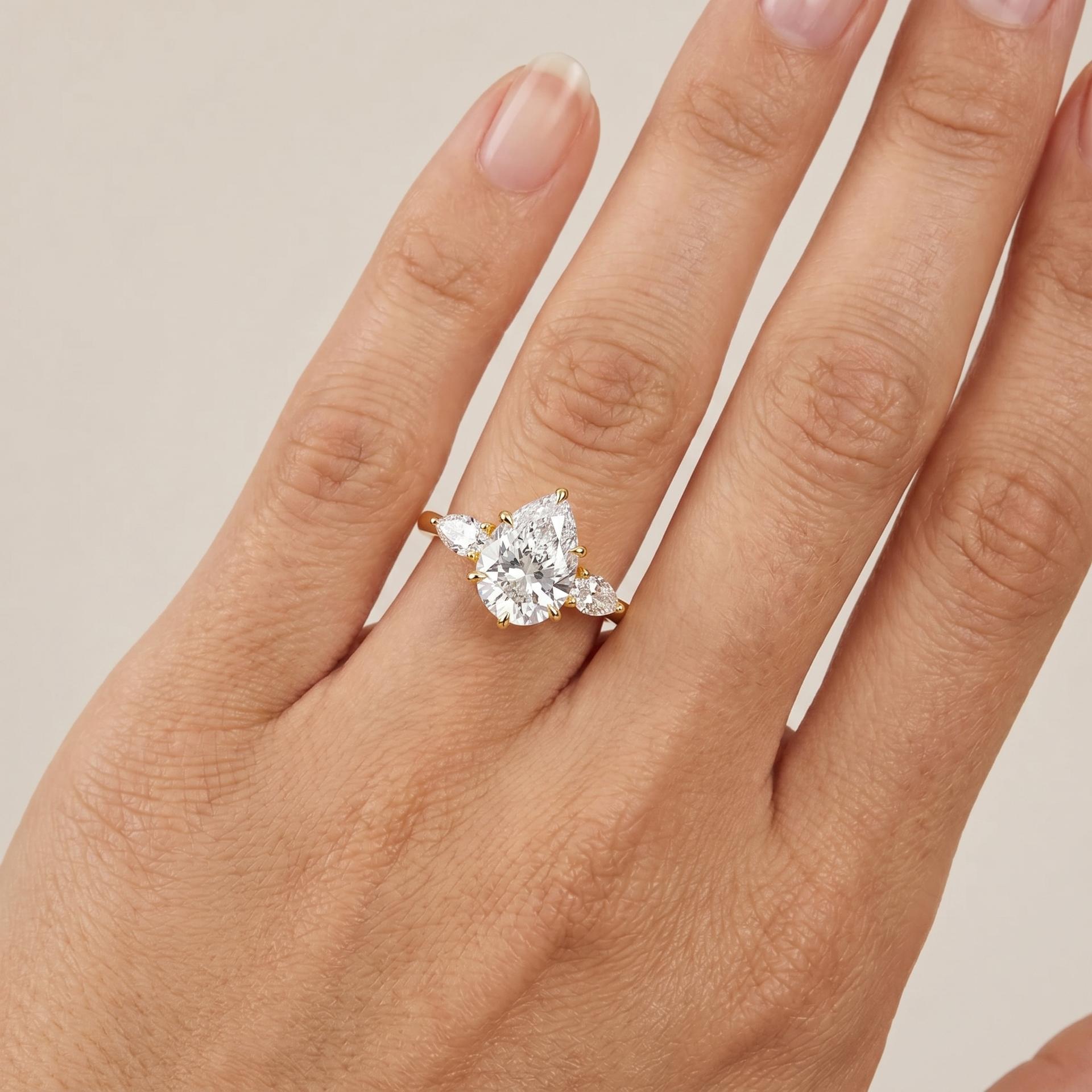 Pear Three Stone Ring on model