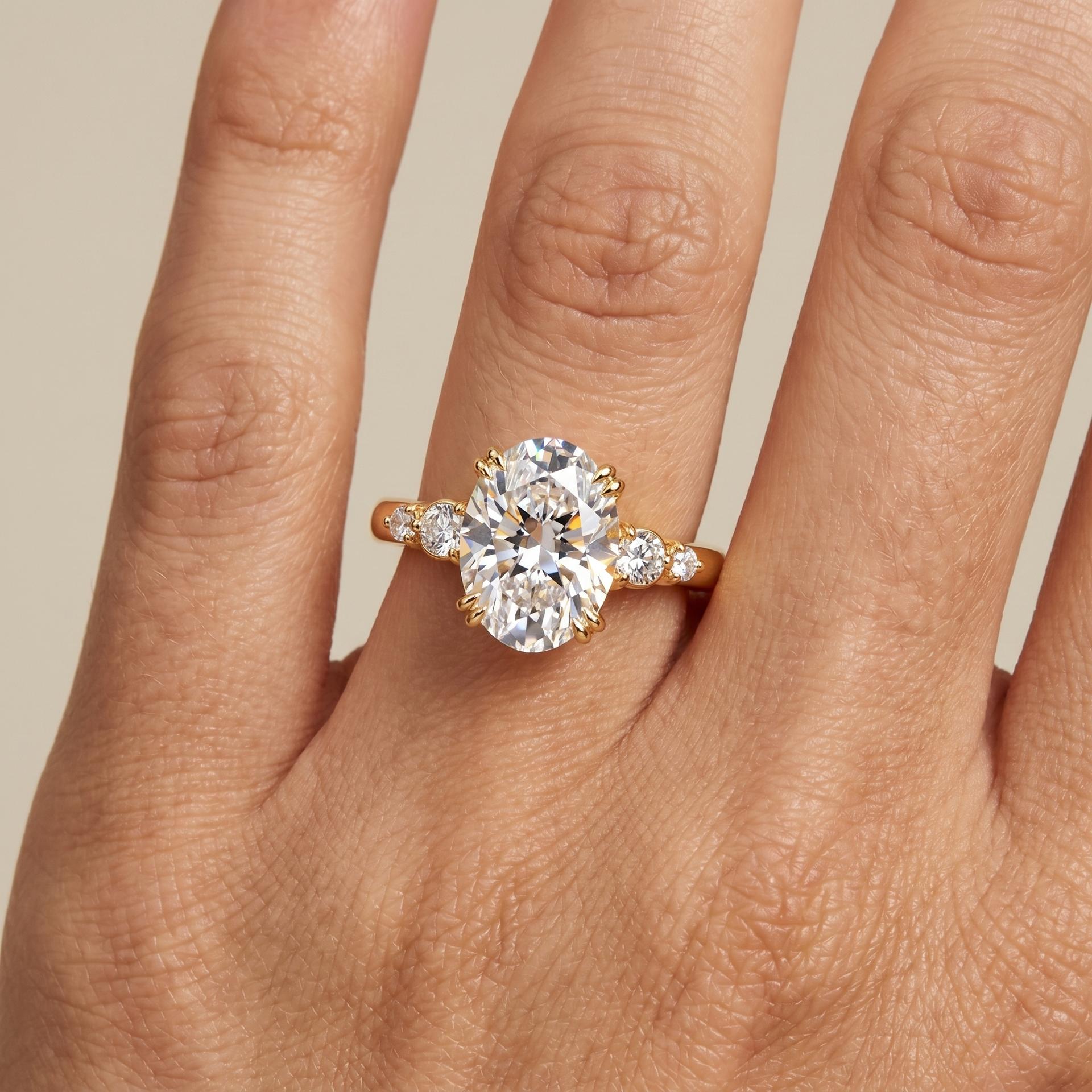 Oval Solitaire Side Stone Ring on model