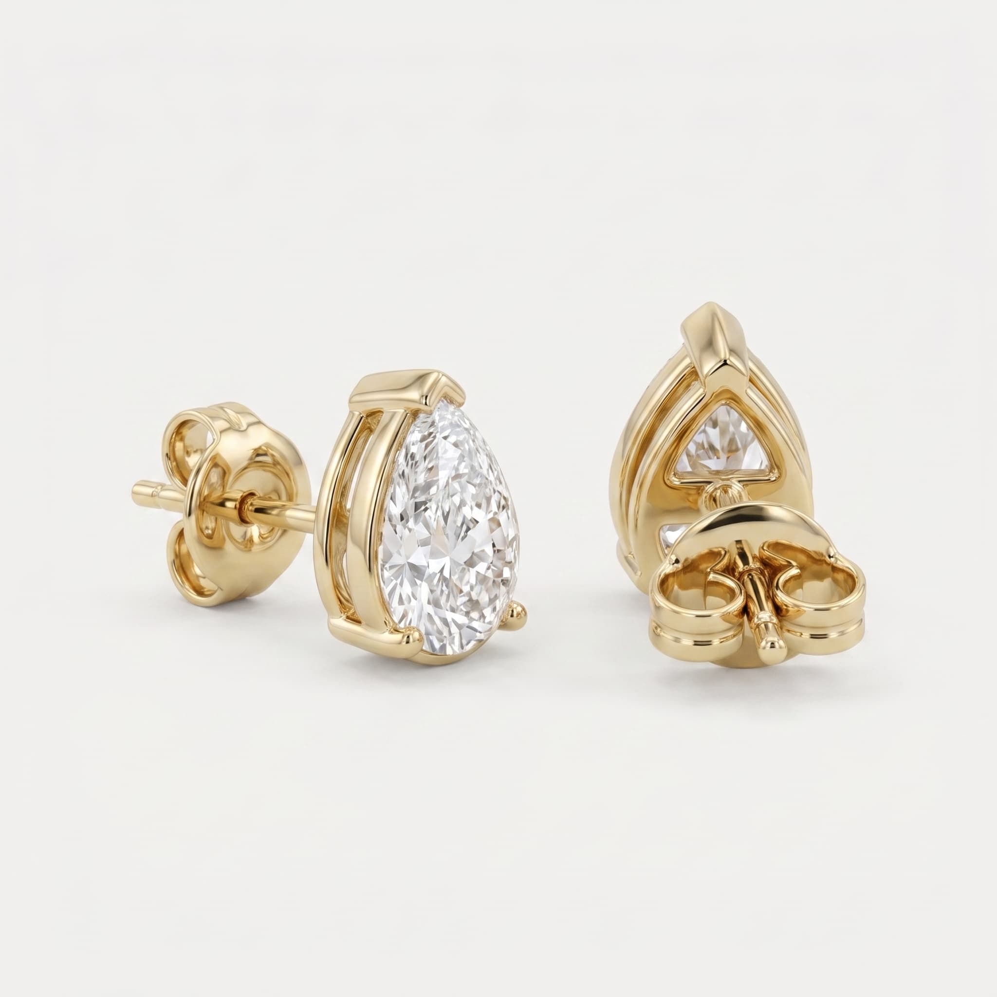Teardrop Promise — Pear Shape Diamond Stud Earrings on model