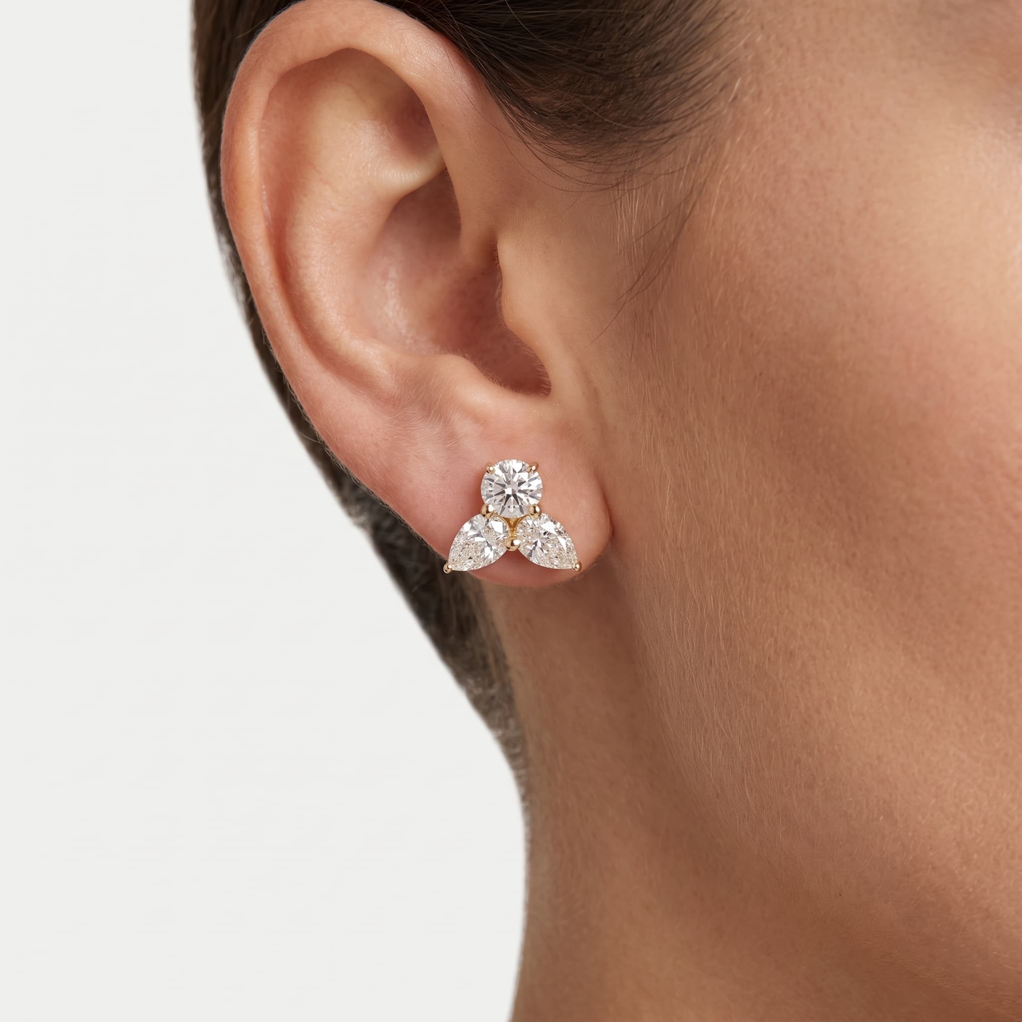 Trio — Round, Pear & Oval Diamond Cluster Stud Earrings on model