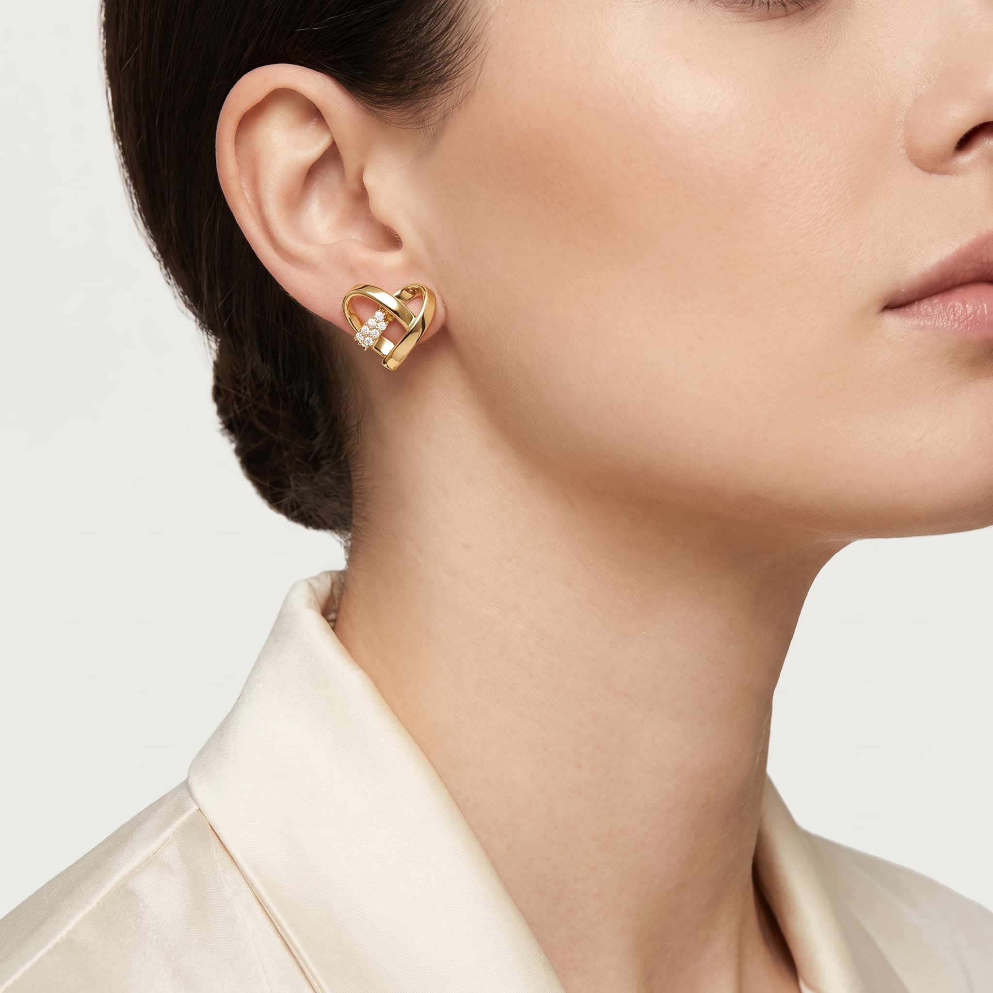 Entwined Heart — Diagonal Diamond Bar Heart Stud Earrings on model