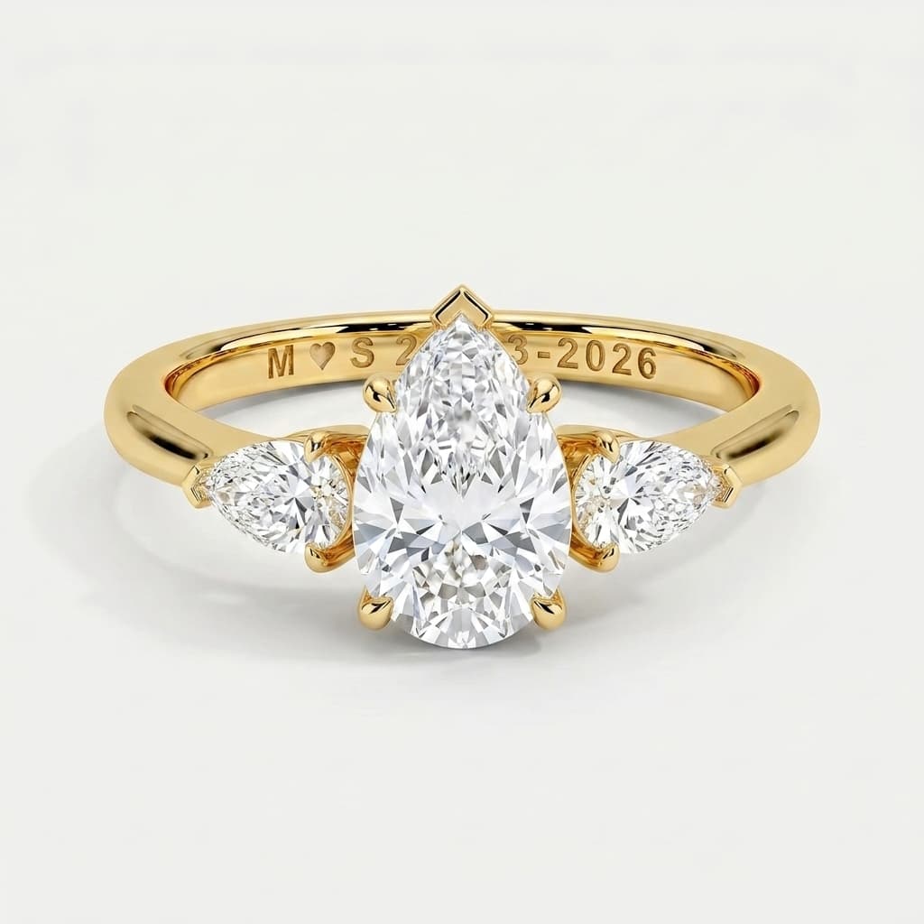 Whisperwing — Pear Diamond Three Stone Ring