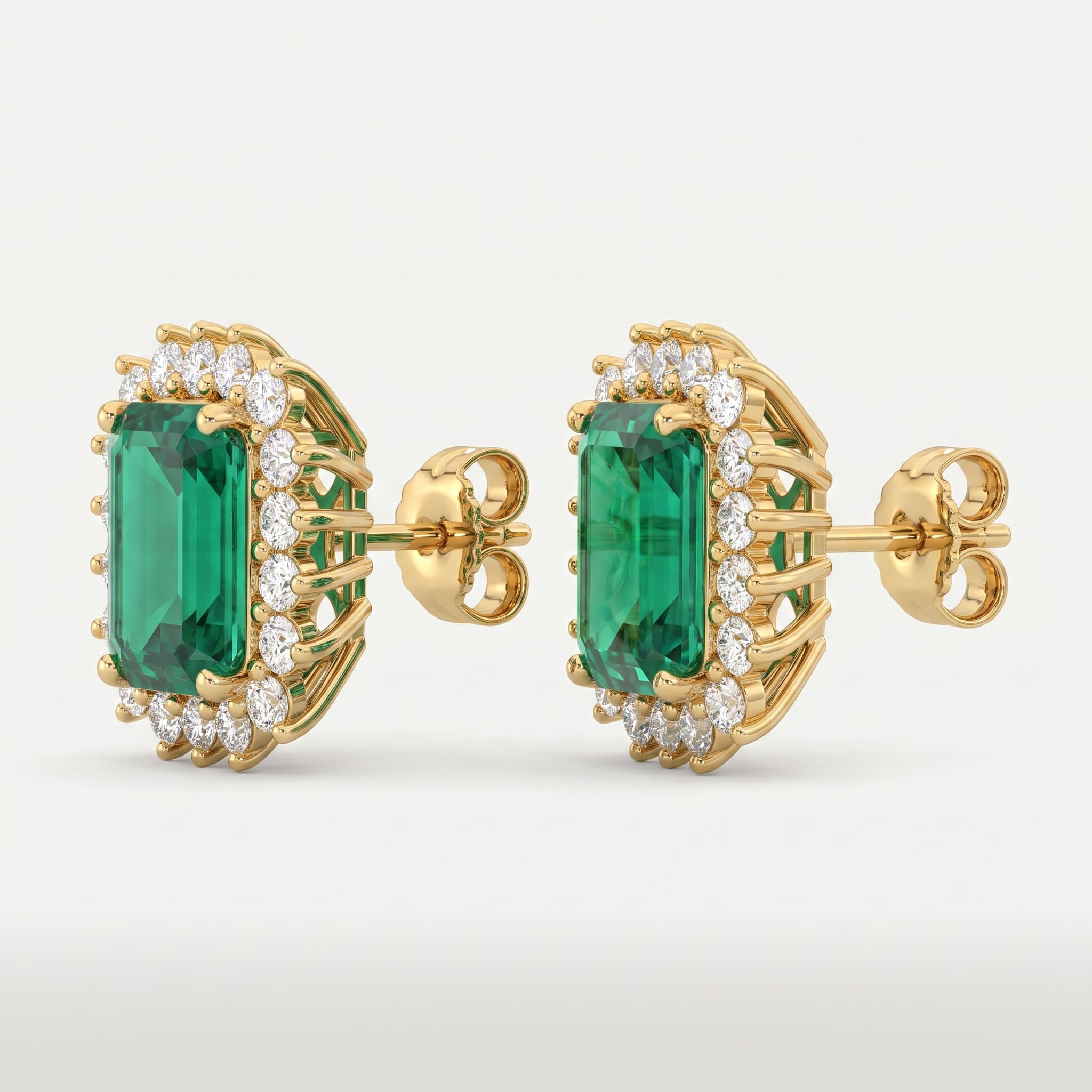 Emerald Bloom — Emerald Cut Halo Stud Earrings on model