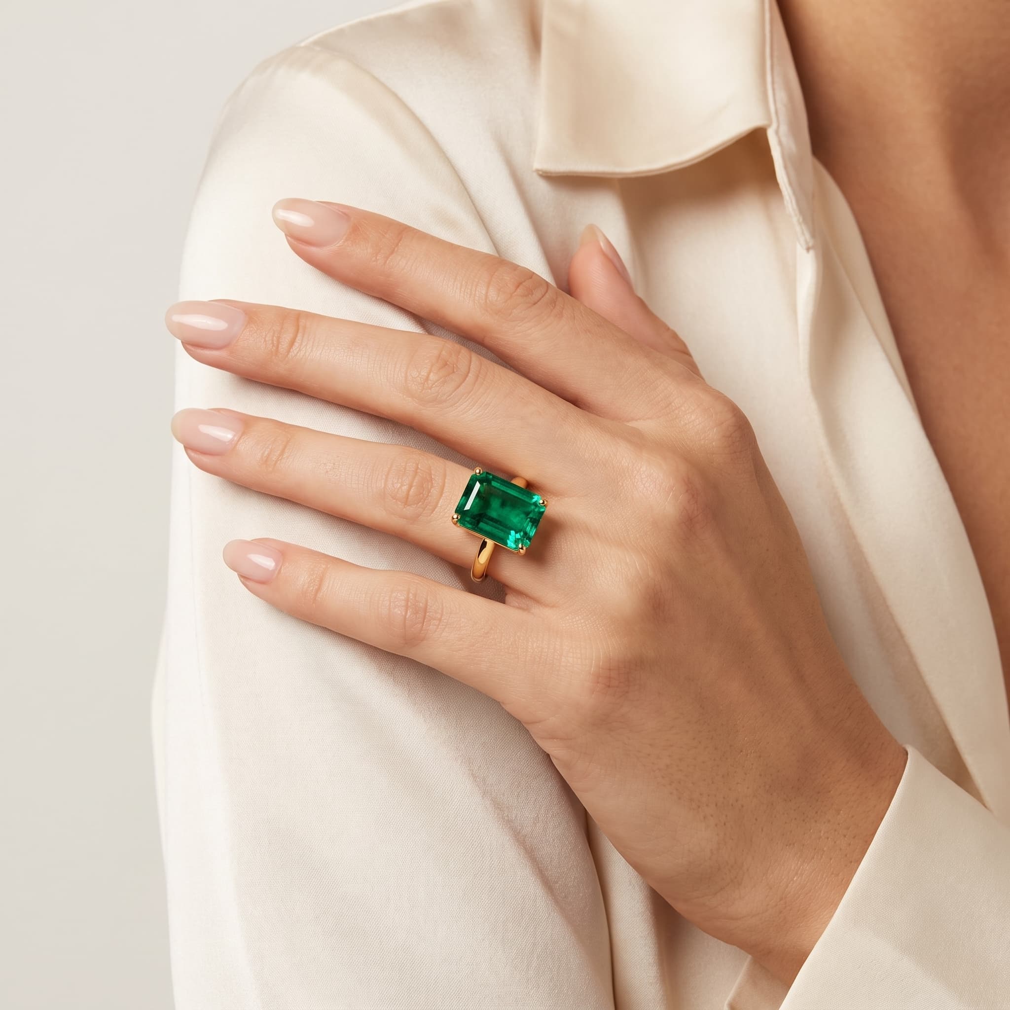 Emerald Majesty — Emerald Cut Solitaire Ring on model